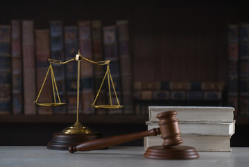 Poster - Lawyers office room with the scales of justice, hammer and old law books in the background