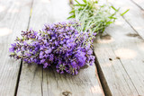 Fototapeta Lawenda - A bouquet of fresh cut lavender with tableware Gzhel