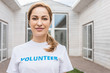 © LIGHTFIELD STUDIOS - attractive volunteer of animals shelter looking at camera