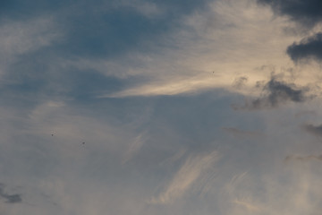 Dramatic sunset sky with clouds. Colorful sunset. Background at dark sky