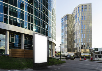 Wall Mural - Blank white banner next to business center and skyscrapers. 3d rendering
