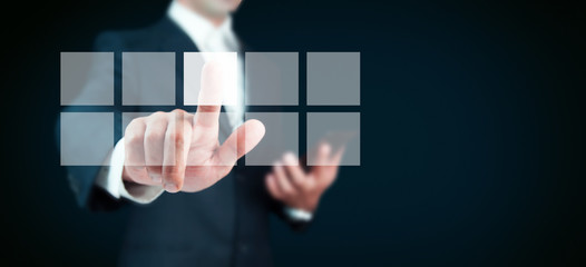 Businessman pressing virtual buttons in concept