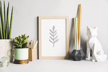 Gray Stylish Room With Wooden Mock Up Poster Frame, Fox Figures, Office Accessories And Design Plants. Modern Desk In Gray Interior. 
