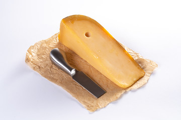 Dutch old Amsterdam cheese, made from cow milk on white background