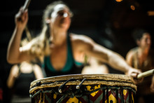 Blurry Girl Dancing And Playing Doun Doun With Two Drum Sticks