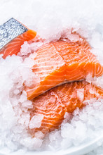 Close-up Fresh Raw Salmon Fillets On Ice