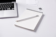 © LIGHTFIELD STUDIOS - close-up shot of notebook and pencil at workplace on white surface