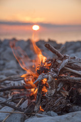 fire burns near the sea