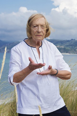 An old woman practicing Tai chi