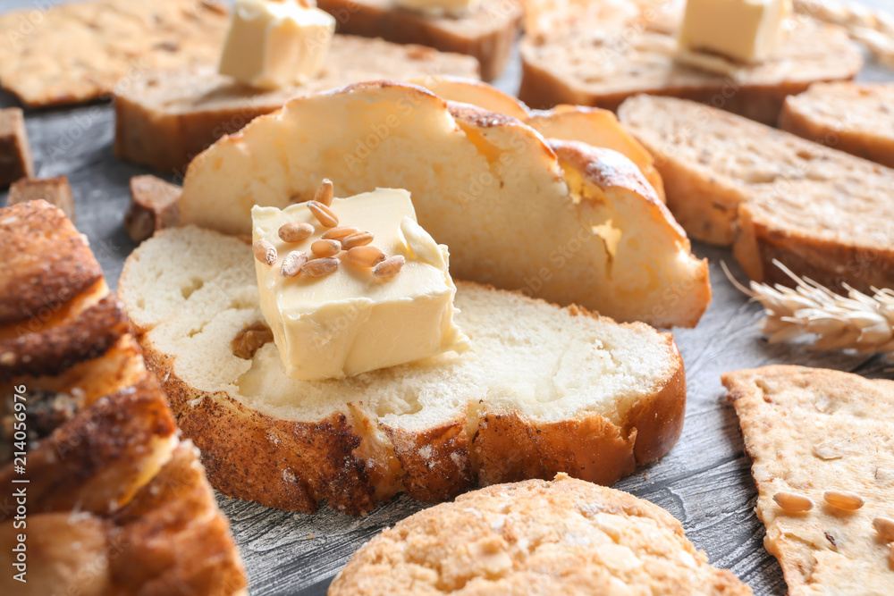 Freshly baked bread with butter on table