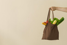 Man Hand Holding Cotton Grocery Bag With Vegetables