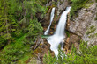 Waterfall in the forest, Fanes Cascade (Cascate di Fanes) in Dolomites
