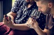 © Rawpixel.com - Man tasting red wine with friends