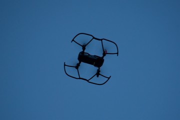 Quadrocopter against the background of the evening sky