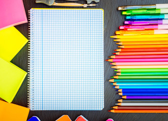 Wall Mural - Back to school pencils and pens rainbow and ruled notebook, retro toned