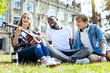 © Viacheslav Yakobchuk - Time to relax. Low angle shot of relaxed young people in casual smiling while listening to their friend playing guitar and singing.