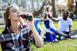 © Viacheslav Yakobchuk - Unforgettable taste. Waist up shot of an attractive young lady closing her eyes while sitting outdoors and enjoying the taste of soda drink.