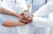 © ASDF - doctors holding hands together at hospital
