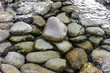 Sea stones and clear water background