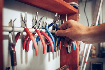 Wall Mural - Different goldsmiths tools on the jewelry workplace. work in jewelry.