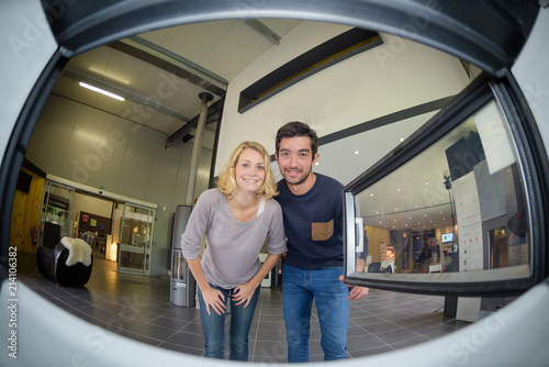 Cuadros en Lienzo Fisheye view of couple from inside a woodburner