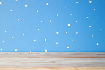 empty wooden table on the blue sky kids background