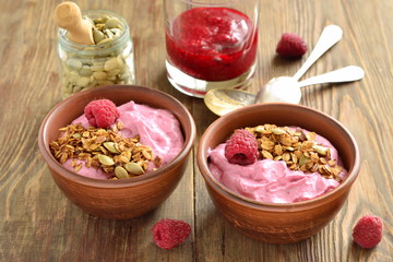 Wall Mural - Raspberry smoothie with granola and pumpkin seeds