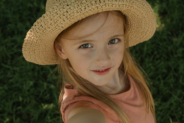 baby,background,beautiful,beauty,blue,caucasian,child,childhood,children,childs,cute,day,dress,face,fashion,female,girl,grass,green,hair,happy,hat,hats,illustration,kid,light,little,looking,modern,nat