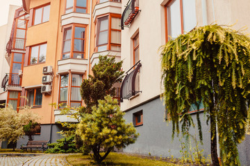 Wall Mural - New multi-storey residential building. Modern house dyed in red and orange colors