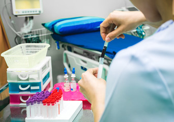 Nurse is collecting blood sample for testing