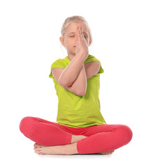 Wall Mural - Little girl practicing yoga on white background