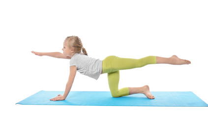 Wall Mural - Little girl practicing yoga on white background