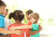 © New Africa - Little children making circle with hands around each other indoors. Unity concept