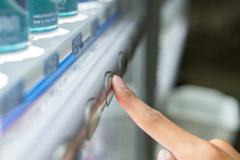 Finger Press Button On The Vending Machine