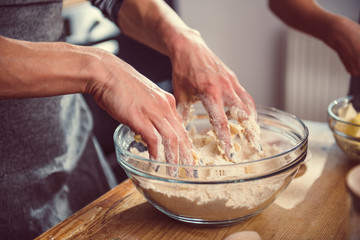 Wall Mural - Woman kneading dough