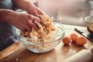 Wall Mural - Woman kneading dough