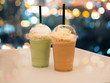 Coffe frappe and green tea frappe on bokeh background.
