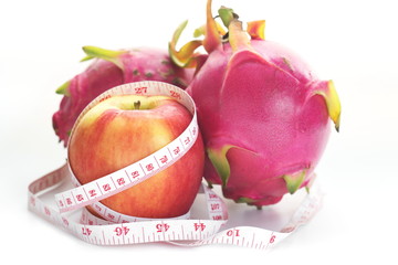 Wall Mural - Healthy fruit concept,Apple and Dragon fruit on white background.