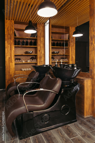 Empty Leather Chairs And Sinks In Modern Hair Salon Buy This