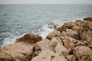 Orange rocky seashore in Spain