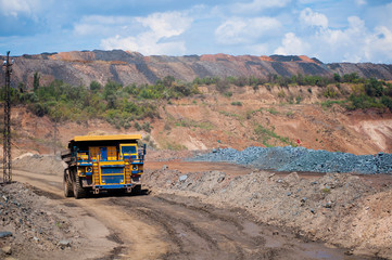 Wall Mural - The mining dump truck transports ore and other minerals in the quarry. Colorful quarry