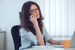 © BurntRedHen - Stressed depressed office worker business woman receiving bad news emergency phone call at work. Looking desperate and uninterested. Problems at work. Borring negotations