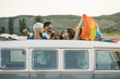 © ADDICTIVE STOCK - People with LGBT flag in van