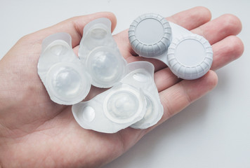 Fototapete - New contact lens in containers.