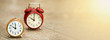 Time management concept - web banner of retro orange and red alarm clocks