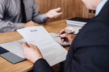 Business man explaining about his profile to two senior manager sitting in during job Interview, interview the job and hiring