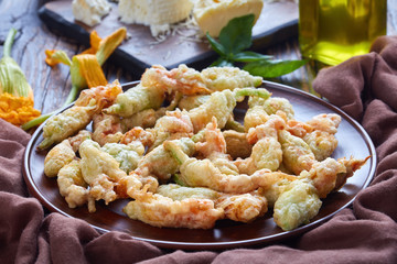 Wall Mural - deep fried zucchini flowers on a plate