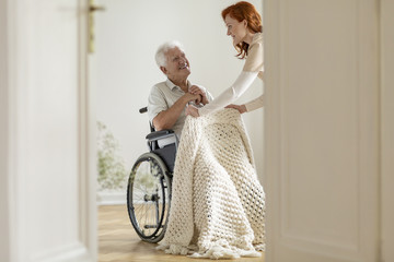 Poster - Smiling disabled man in the wheelchair and friendly volunteer in the nursing house