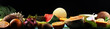 © beats_ - Assortment of tropical fruits with leaves of palm trees and exotic plants