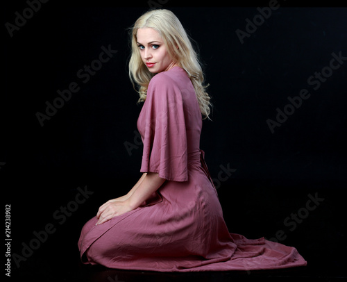 Fotomural full length portrait of blonde girl wearing long purple dress